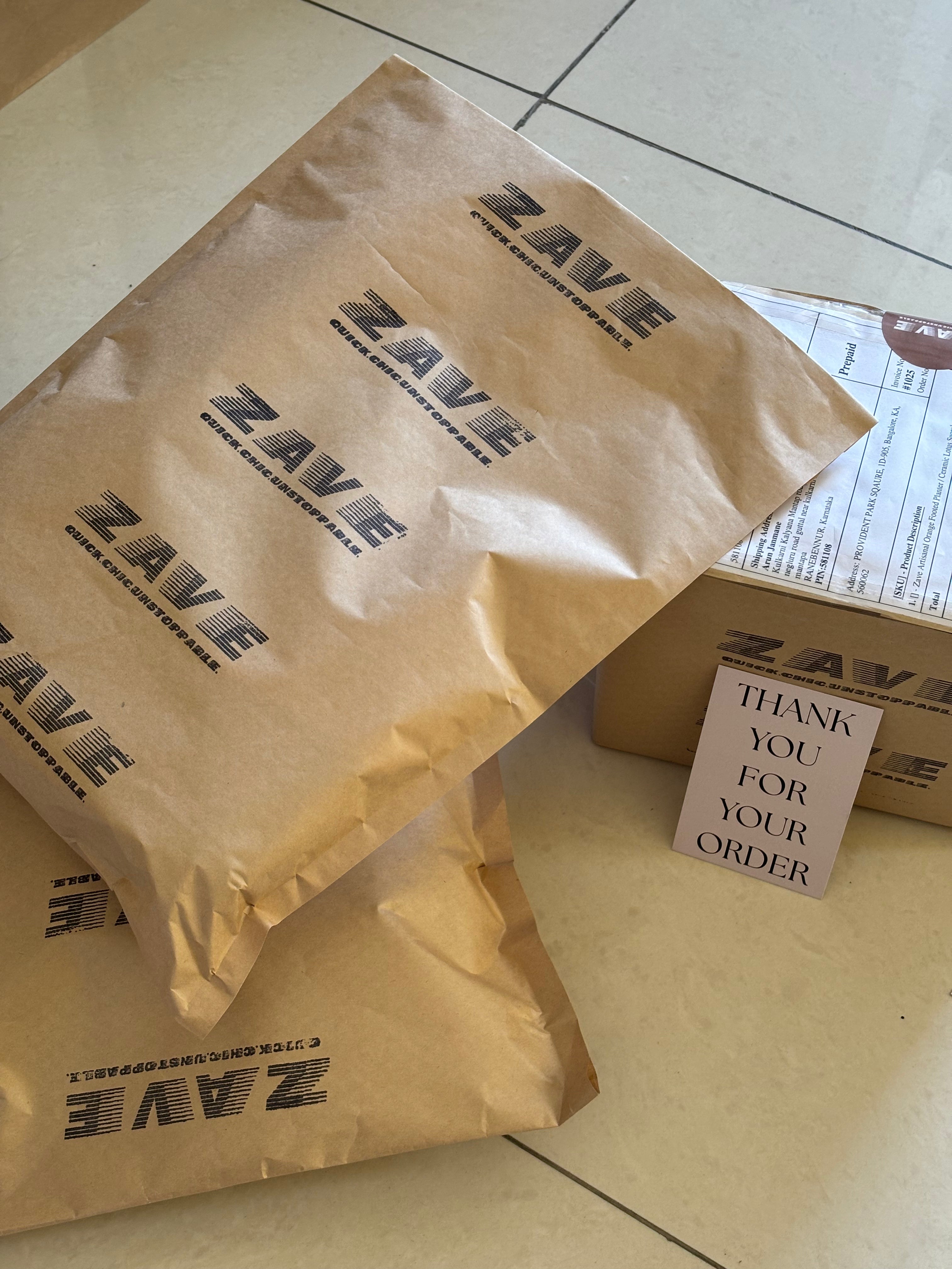 ZAVE branded kraft paper packaging with logo print and a Thank You card, ready for dispatch — fashion and beauty delivery in Bangalore.